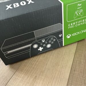 Black Xbox Console and black monitor